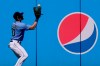 Seattle Mariners Jarred Kelenic fields an RBI double by Cleveland Indians' Josh Naylor during the first inning of a spring training baseball game Tuesday, March 2, 2021, in Peoria, Ariz. (AP Photo/Charlie Riedel)