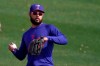 Texas Rangers' Isiah Kiner-Falefa throws during spring training baseball practice Friday, Feb. 26, 2021, in Surprise, Ariz. (AP Photo/Charlie Riedel)