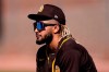 San Diego Padres' Fernando Tatis Jr. waits to bat during spring training baseball practice Tuesday, Feb. 23, 2021, in Peoria, Ariz. (AP Photo/Charlie Riedel)