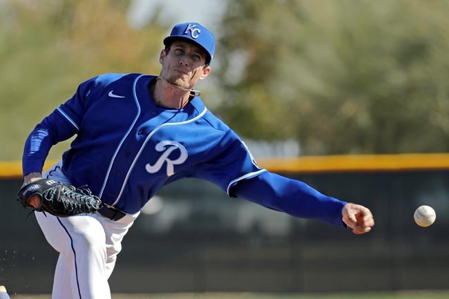 Kansas City Royals relief pitcher Tim Hill throws during baseball spring training Sunday, Feb. 16, 2020, in Surprise, Ariz. (AP Photo/Charlie Riedel)