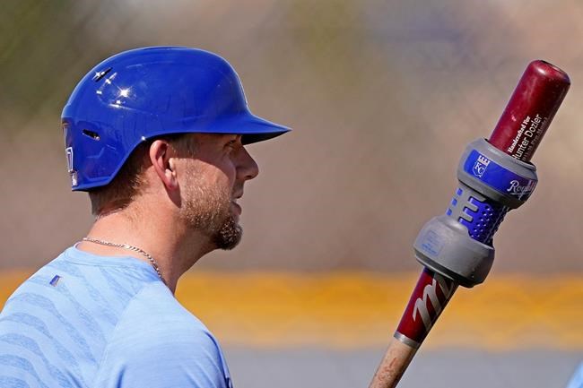 Kansas City Royals' Hunter Dozier gets ready to bat during spring training baseball practice Monday, Feb. 22, 2021, in Surprise, Ariz. (AP Photo/Charlie Riedel)