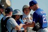 Texas Rangers pitcher Corey Kluber, right, gives autographs during spring training baseball practice Friday, Feb. 14, 2020, in Surprise, Ariz. (AP Photo/Charlie Riedel)