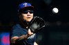 Texas Rangers' Shin-Soo Choo catches a ball during spring training baseball practice Friday, Feb. 14, 2020, in Surprise, Ariz. (AP Photo/Charlie Riedel)