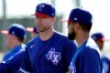 Texas Rangers' Robinson Chirinos, right, and Corey Kluber talk during spring training baseball practice Friday, Feb. 14, 2020, in Surprise, Ariz. (AP Photo/Charlie Riedel)