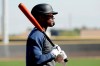 Seattle Mariners' Kyle Lewis waits to bat during spring training baseball practice Tuesday, Feb. 18, 2020, in Peoria, Ariz. (AP Photo/Charlie Riedel)