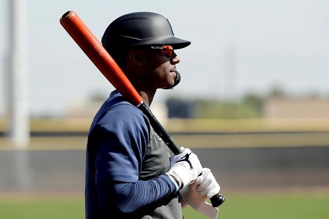 Seattle Mariners' Kyle Lewis waits to bat during spring training baseball practice Tuesday, Feb. 18, 2020, in Peoria, Ariz. (AP Photo/Charlie Riedel)