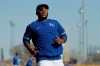 Kansas City Royals' third baseman Maikel Franco runs during spring training baseball practice Wednesday, Feb. 19, 2020, in Surprise, Ariz. (AP Photo/Charlie Riedel)