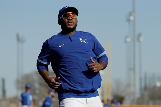 Kansas City Royals' third baseman Maikel Franco runs during spring training baseball practice Wednesday, Feb. 19, 2020, in Surprise, Ariz. (AP Photo/Charlie Riedel)