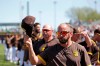 San Diego Padres manager Jayce Tingler tips his cap at the conclusion of the national anthem before a spring training baseball game against the Los Angeles Dodgers, Monday, March 9, 2020, in Peoria, Ariz. (AP Photo/Elaine Thompson)