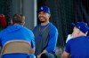 Los Angeles Dodgers outfielder Mookie Betts, center, talks with second baseman Max Muncy, left, and right fielder Joc Pederson, right, during spring training baseball Monday, Feb. 17, 2020, in Phoenix. (AP Photo/Gregory Bull)