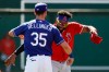 Los Angeles Dodgers center fielder Cody Bellinger (35) greets Los Angeles Angels center fielder Jo Adell, right, before a spring training baseball game Wednesday, Feb. 26, 2020, in Glendale, Ariz. (AP Photo/Gregory Bull)