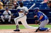 Milwaukee Brewers' Lorenzo Cain grounds out while batting during the first inning of a spring training baseball game against the Kansas City Royals, Thursday, Feb. 27, 2020, in Phoenix. (AP Photo/Gregory Bull)