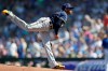 Milwaukee Brewers starting pitcher Freddy Peralta works against a Chicago Cubs batter during the first inning of a spring training baseball game Saturday, Feb. 29, 2020, in Mesa, Ariz. (AP Photo/Gregory Bull)