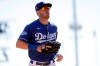 Los Angeles Dodgers center fielder Cody Bellinger runs off the field during the third inning of a spring training baseball game against the Los Angeles Angels, Wednesday, Feb. 26, 2020, in Glendale, Ariz. (AP Photo/Gregory Bull)
