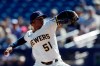 Milwaukee Brewers starting pitcher Freddy Peralta works against a Seattle Mariners batter during the first inning of a spring training baseball game Tuesday, Feb. 25, 2020, in Phoenix. (AP Photo/Gregory Bull)