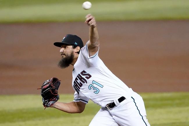 Arizona Diamondbacks starting pitcher Caleb Smith (31) throws against the Seattle Mariners during the first inning of a baseball game, Friday, Sept. 11, 2020, in Phoenix. AP Photo/Matt York)
