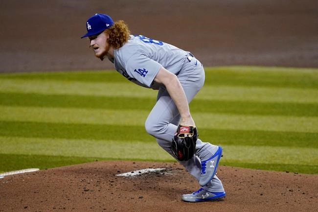 Los Angeles Dodgers starting pitcher Dustin May gets up after taking a line drive to the foot off the bat of Arizona Diamondbacks' Josh Rojas during the first inning of a baseball game, Thursday, Sept. 10, 2020, in Phoenix. (AP Photo/Matt York)