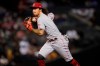 Cincinnati Reds' Jonathan India fields a ground out hit by Arizona Diamondbacks' Josh Rojas during the seventh inning of a baseball game, Friday, April 9, 2021, in Phoenix. (AP Photo/Matt York)