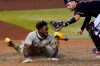 San Diego Padres' Jorge Mateo is tagged out by Arizona Diamondbacks catcher Carson Kelly for the final out of the game during the ninth inning of a baseball game Saturday, Aug. 15, 2020, in Phoenix.The Diamondbacks won 7-6. (AP Photo/Matt York)