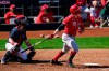 Cincinnati Reds' Joey Votto (19) watches his run-scoring single hit to left field as Cleveland Indians catcher Austin Hedges, left, looks on during the third inning of a spring training baseball game Sunday, Feb. 28, 2021, in Goodyear, Ariz. (AP Photo/Ross D. Franklin)