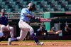 Seattle Mariners' Taylor Trammell fouls a pitch off his leg during the second inning of a spring training baseball game against the Cleveland Indians, Monday, March 8, 2021, in Goodyear, Ariz. (AP Photo/Ross D. Franklin)
