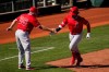 Los Angeles Angels' Jon Jay, right, celebrates his home run with third base coach Brian Butterfield (55) during the sixth inning of a spring training baseball game against the Cleveland Indians, Wednesday, March 10, 2021, in Goodyear, Ariz. (AP Photo/Ross D. Franklin)