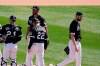 Chicago White Sox manager Tony LaRussa (22) removes starting pitcher Lucas Giolito (27) from the baseball game as catcher Yasmani Grandal, left, and first baseman Jose Abreu (79) wait on the mound during the fifth inning of a spring training matchup against the San Francisco Giants on Monday, March 22, 2021, in Phoenix. (AP Photo/Ross D. Franklin)