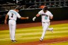 Arizona Diamondbacks' Kole Calhoun (56) celebrates with Tony Perezchica after hitting a solo home run against the San Diego Padres in the sixth inning during a baseball game, Friday, Aug 14, 2020, in Phoenix. (AP Photo/Rick Scuteri)