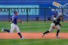 Texas Rangers third baseman Josh Jung watches his throw while chasing Chicago White Sox's Andrew Vaughn back toward second base on a ball hit by Micker Adolfo during the sixth inning of a spring training baseball game Friday, March 12, 2021, in Surprise, Ariz. Vaughn was tagged out. (AP Photo/Sue Ogrocki)