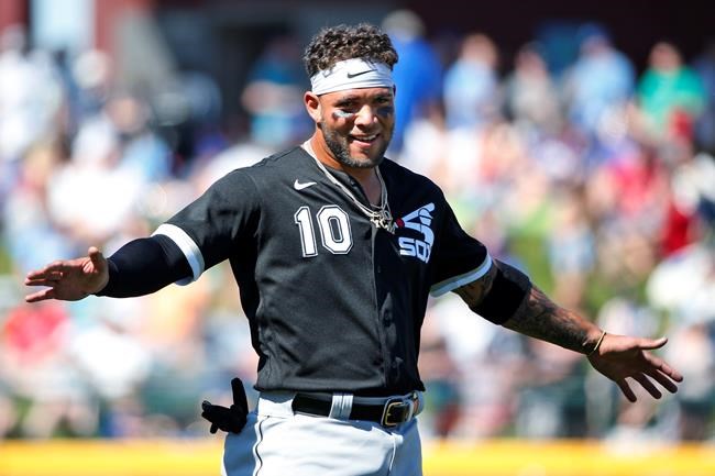 Chicago White Sox third baseman Yoan Moncada (10) gestures after the second inning of a spring training baseball game against the Chicago Cubs, Friday, March 6, 2020, in Mesa, Ariz. (AP Photo/Sue Ogrocki)