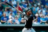 Chicago White Sox third baseman Yoan Moncada (10) watches his single in the first inning of a spring training baseball game against the Chicago Cubs, Friday, March 6, 2020, in Mesa, Ariz. (AP Photo/Sue Ogrocki)