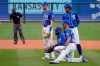 Kansas City Royals infielders, from left, Hunter Dozier, Carlos Santana, Whit Merrifield and Adalberto Mondesi watch during a pitching change in the fifth inning of a spring training baseball game against the Arizona Diamondbacks, Thursday, March 25, 2021, in Surprise, Ariz. (AP Photo/Sue Ogrocki)