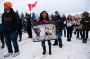 Anti-mask protestors from the Hugs Over Masks group attend a rally in Steinbach on Saturday. (Daniel Crump / Winnipeg Free Press files)