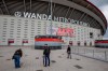 A soccer supporter takes snapshots of Atletico Madrid hall of fame plates at the Wanda Metropolitano stadium in Madrid, Spain, Tuesday, April 20, 2021. A group of 12 elite English, Spanish and Italian clubs dramatically split European soccer on Sunday by announcing the formation of a largely-closed Super League. The Super League's founding chairman Florentino Perez on Tuesday, April 20, 2021 says the competition is being created to save soccer for everyone and not to make the rich clubs richer. The Real Madrid president says it's 
