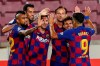 FC Barcelona players celebrate their opening goal during the Spanish La Liga soccer match between FC Barcelona and Atletico Madrid at the Camp Nou stadium in Barcelona, Spain, Tuesday, June 30, 2020. (AP Photo/Joan Monfort)