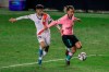 Barcelona's Antoine Griezmann, right, duels for the ball with Rayo's Mario Hernandez during a Spanish Copa del Rey round of 16 soccer match between Rayo Vallecano and FC Barcelona at the Vallecas stadium in Madrid, Spain, Wednesday, Jan. 27, 2021. (AP Photo/Manu Fernandez)