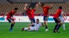 Kosovo's Vedat Muriqi, center, is tackled during the World Cup 2022 Group B qualifying round soccer match between Spain and Kosovo at La Cartuja stadium in Seville, Spain, Wednesday March 31, 2021. (AP Photo/Miguel Angel Morenatti)