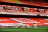 Arsenal players warm up prior the English Premier League soccer match between Arsenal and Norwich City at the Emirates Stadium in London, England, Wednesday, July 1, 2020. (Richard Heathcote/Pool via AP)