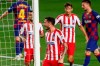 Atletico Madrid's Saul, center, celebrates after scoring his side's second goal during the Spanish La Liga soccer match between FC Barcelona and Atletico Madrid at the Camp Nou stadium in Barcelona, Spain, Tuesday, June 30, 2020. (AP Photo/Joan Monfort)