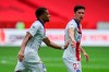 PSG's Kylian Mbappe, left, is congratulated by teammate Julian Draxler after scoring the opening goal during the French League One soccer match between Nice and Paris Saint-Germain at the Allianz Riviera stadium in Nice, France, Sunday, September 20, 2020. (AP Photo/Daniel Cole)