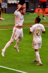 Real Madrid's Sergio Ramos, left, celebrates after scoring the opening goal from a penalty shoot during the Spanish La Liga soccer match between Athletic Club and Real Madrid at the San Manes stadium in Bilbao, Spain, Sunday, July 5, 2020. (AP Photo/Alvaro Barrientos)
