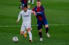 Real Madrid's Eden Hazard, left, duels for the ball with Levante's Roger Marti during the Spanish La Liga soccer match between Real Madrid and Levante at the Alfredo Di Stefano stadium in Madrid, Spain, Saturday, Jan. 30, 2021. (AP Photo/Manu Fernandez)