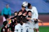 Real Madrid and Real Sociedad players jump for the header during the Spanish La Liga soccer match between Real Madrid and Real Sociedad at Alfredo di Stefano stadium in Madrid, Spain, Monday, March 1, 2021. (AP Photo/Bernat Armangue)