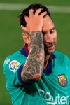 Barcelona's Lionel Messi reacts during the Spanish La Liga soccer match between FC Barcelona and Villareal at La Ceramica stadium in Villareal, Spain, Sunday, July 5, 2020. (AP Photo/Jose Miguel Fernandez)