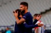 France's Olivier Giroud, right, is congratulated by Antoine Griezmann after scoring a penalty shoot during a UEFA Nations League soccer match against Croatia at the Stade de France stadium in Saint-Denis, north of Paris, France, Tuesday, Sept. 8, 2020. (AP Photo/Francois Mori)