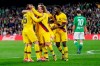 Barcelona's Clement Lenglet, left, is congratulated by teammates after scoring during La Liga soccer match between Betis and Barcelona at the Benito Villamarin stadium in Seville, Spain, Sunday, Feb. 9, 2020. (AP Photo/Miguel Morenatti)