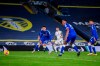 Leeds United's Raphinha, center, scores his team first goal during the English Premier League soccer match between Leeds United and Everton at Elland Road Stadium in Leeds, England, Wednesday, Feb. 3, 2021. (Michael Regan/Pool via AP)