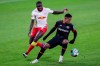 Leipzig's Dayot Upamecano, left, and Leverkusen's Leon Bailey challenge for the ball during the German Bundesliga soccer match between RB Leipzig and Bayer 04 Leverkusen in Leipzig, Germany, Saturday, Jan. 30, 2021. (AP Photo/Michael Sohn)