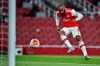 Arsenal's Alexandre Lacazette scores his team first goal during the English Premier League soccer match between Arsenal and Liverpool at the Emirates Stadium in London, England, Wednesday, July 15, 2020. (Glyn Kirk/Pool via AP)