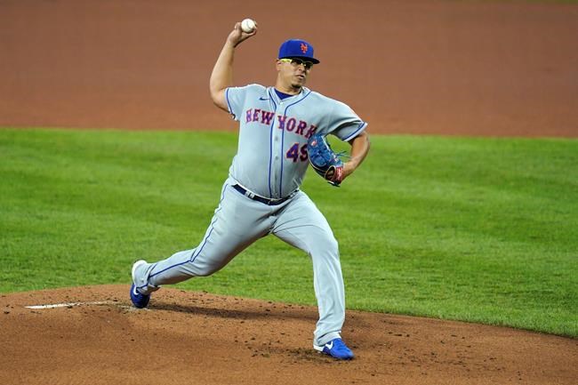 New York Mets starting pitcher Ariel Jurado throws a pitch to the Baltimore Orioles during the first inning of a baseball game, Tuesday, Sept. 1, 2020, in Baltimore. (AP Photo/Julio Cortez)